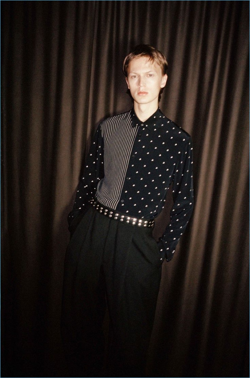 Sporting a polka dot shirt, Jonas GlÃ¶er stars in McQ's spring-summer 2018 campaign.