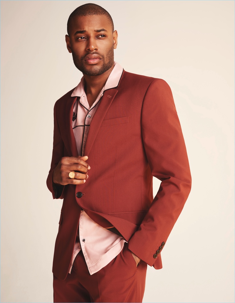 Suiting up, Roger Dupé wears a dashing look from River Island's fall-winter 2018 collection.