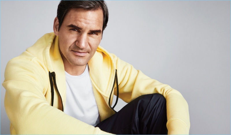 Starring in a photo shoot, Roger Federer wears a Tom Ford sweatshirt, Frame t-shirt, and Nike track pants.