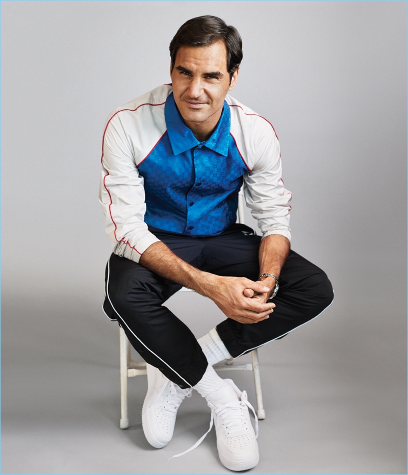 Front and center, Roger Federer wears a Gucci jacket, Nike track pants and sneakers.