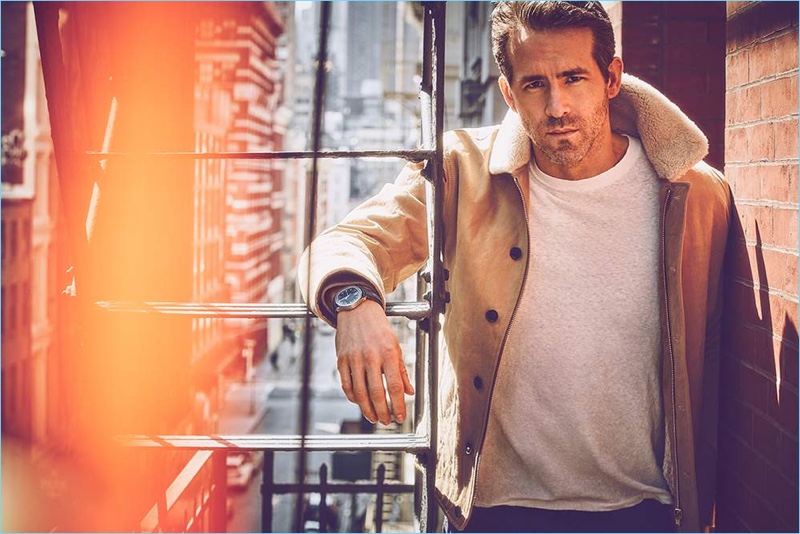 Ryan Reynolds wears a Kent & Curwen jacket with a Simon Miller t-shirt. He also wears Monitaly trousers and a Piaget watch.