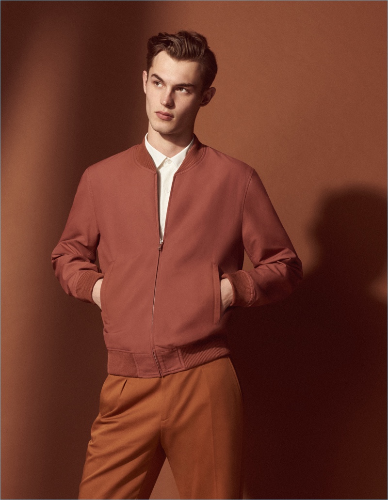 British model Kit Butler embraces monochromatic dressing in a look from Sandro's Mr Porter collaboration.