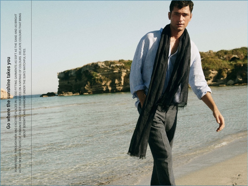 Connecting with Massimo Dutti, Sean O'Pry wears a linen band collar shirt. He also dons  a linen scarf and chinos.