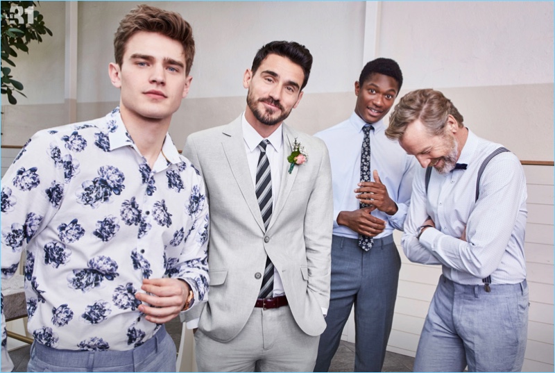 Soft blues hues and floral prints come together from LE 31. Models Bo Develius, Arthur Kulkov, Hamid Onifade, and Rainer Andreesen don smart tailored pieces for this year's wedding season. Arthur is dashing in a grey Bosco chambray cotton-linen suit.