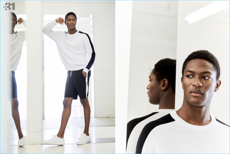 Connecting with Simons, Hamid Onifade wears a sweater and shorts by LE 31.