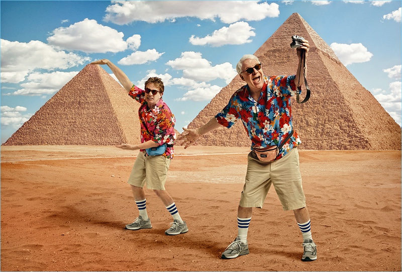 Martin Short and Steven Martin wear AMI shirts with Gap shorts, American Apparel socks, and New Balance sneakers. They also don RetroSuperFuture sunglasses and Eastpak belt bags.