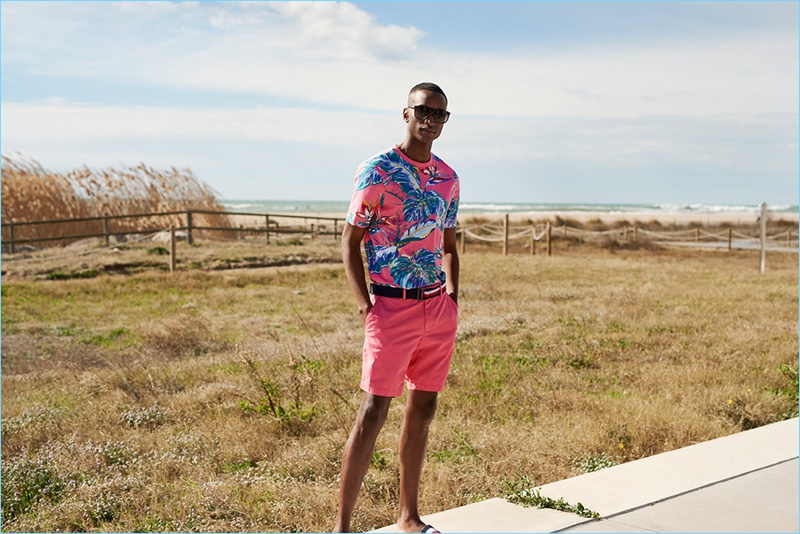 Embracing pink, Oliver Kumbi wears vacation style from Tommy Hilfiger.