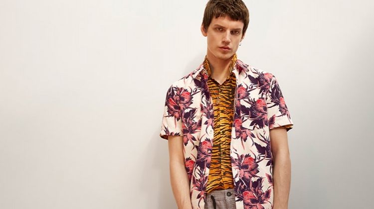 Layering for a bold effect, Theo Neilson wears a floral printed short-sleeve shirt with a tiger print shirt from Topman.
