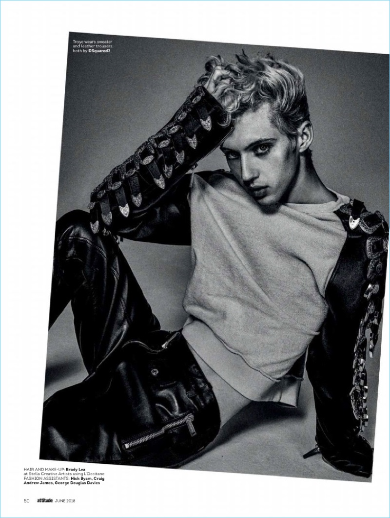Singer Troye Sivan strikes a pose in a leather look from Dsquared2.