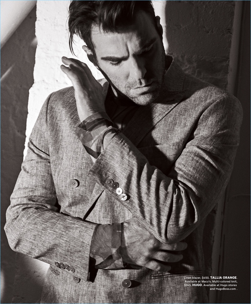 Taking in a quiet moment, Zachary Quinto wears a Tallia Orange blazer and HUGO sweater.