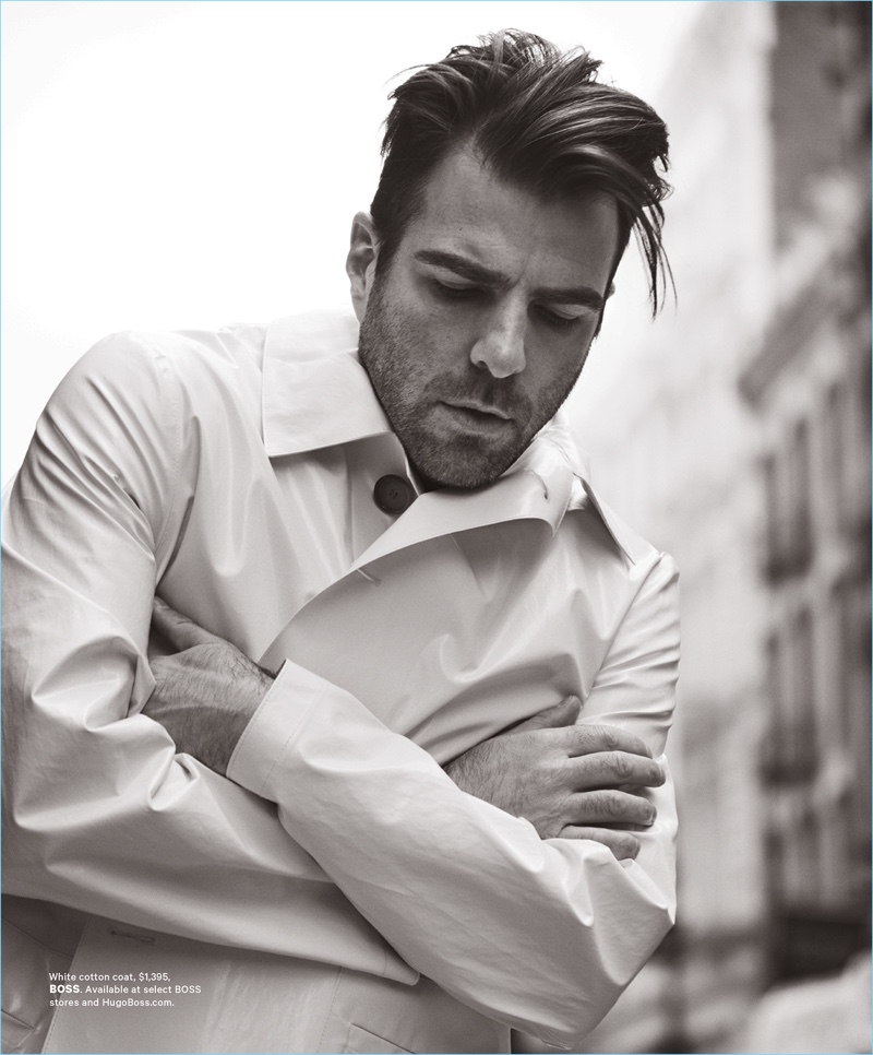 Appearing in a black and white image, Zachary Quinto wears a BOSS coat.