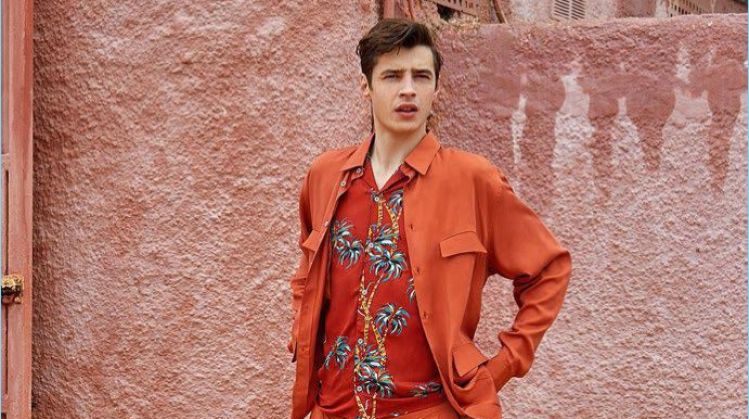 Adrien Sahores wears a shirt and pants by Lemaire. The French model also sports a tropical print shirt from The Kooples with Paraboot shoes.