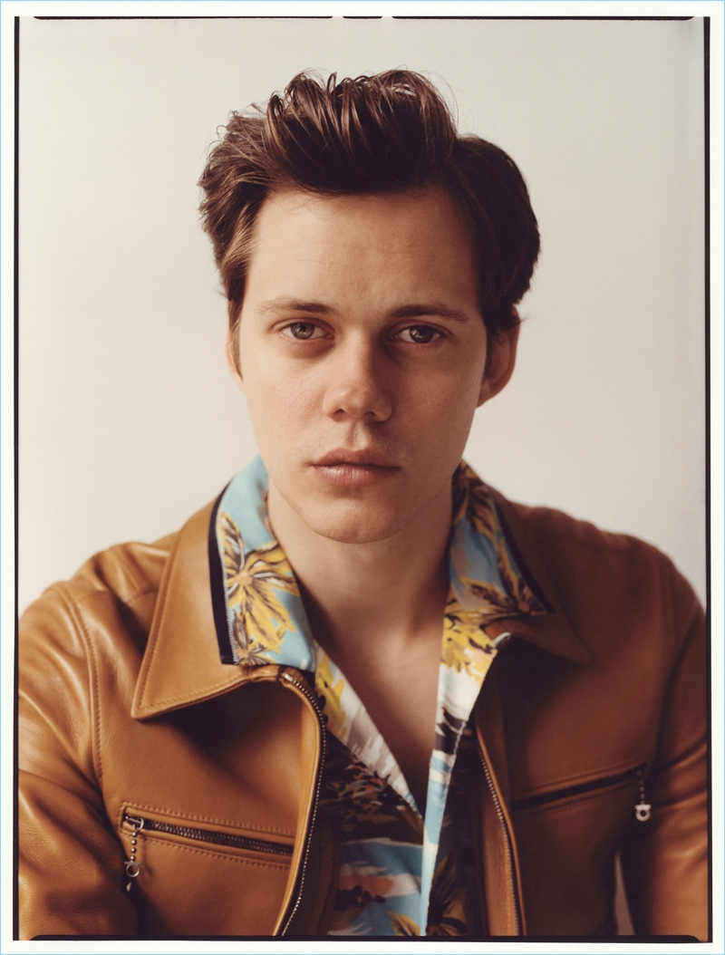 Ready for his close-up, Bill Skarsgård wears a Salvatore Ferragamo leather jacket. The actor also dons a Coach 1941 shirt.