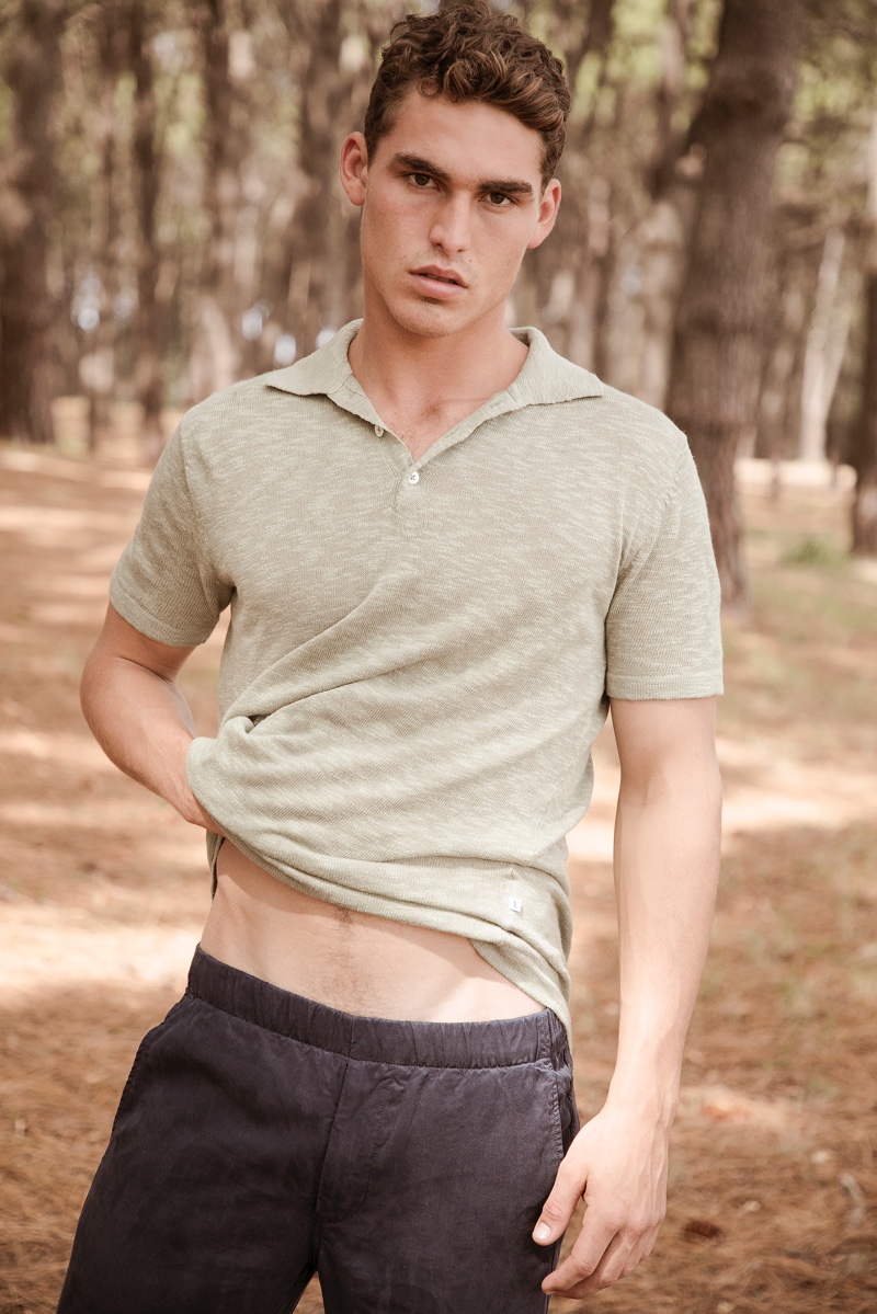 Embracing summer style, Brayden wears a lightweight polo and shorts from Venroy.