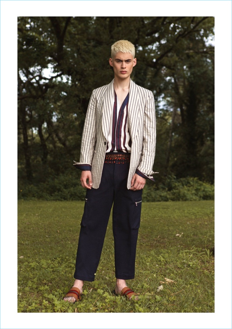 Venturing outdoors, Charly Ignacio dons a dapper look from Christian Pellizzari's spring-summer 2019 collection. 