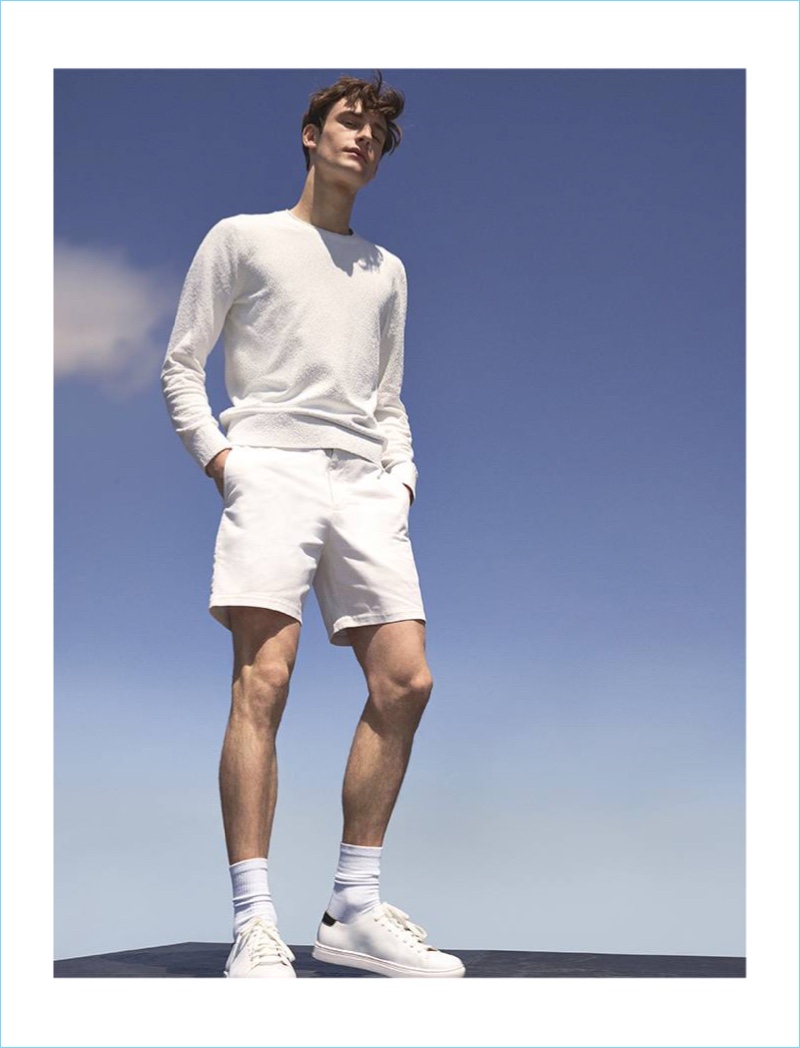 Donning all white, Matt Doran wears a Club Monaco bouclé crew and Baxter shorts.