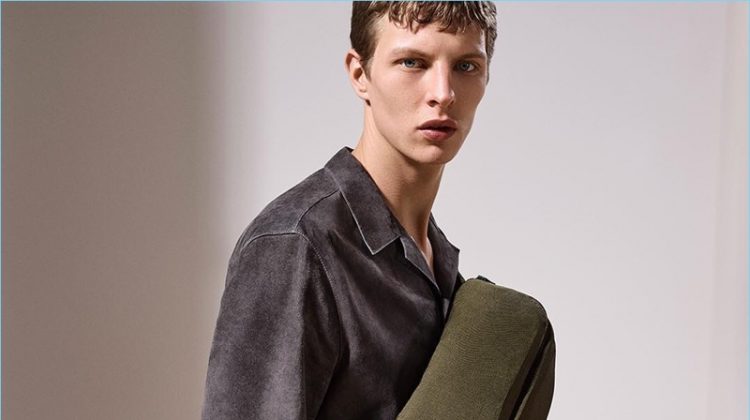 Model Tim Schuhmacher sports Dunhill's trendy belt bag with a suede shirt.