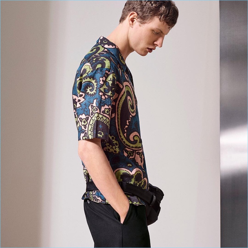 Embracing a bold print, Tim Schuhmacher wears a paisley print shirt from Dunhill.