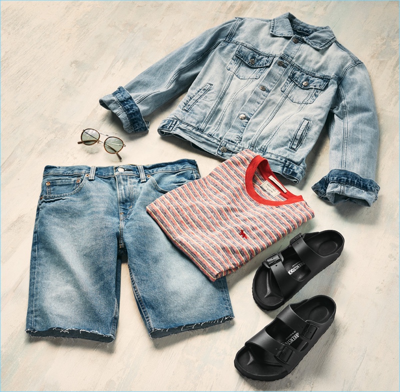 Birkenstock sandals, Ksubi jean jacket, Oliver Peoples sunglasses, Maison Kitsune striped t-shirt, and Levi's Red Tab Kob 511 cutoff shorts.