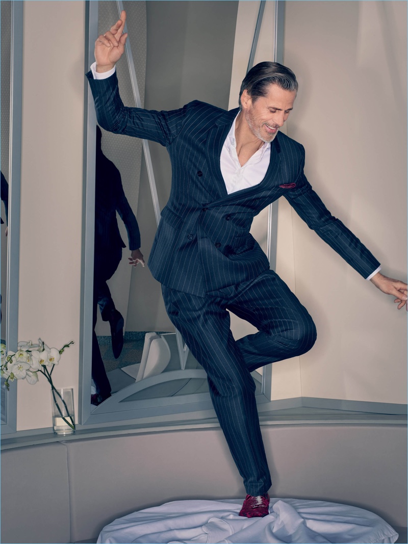 Mark Vanderloo dons a pinstripe suit for Emporio Armani's fall-winter 2018 campaign.