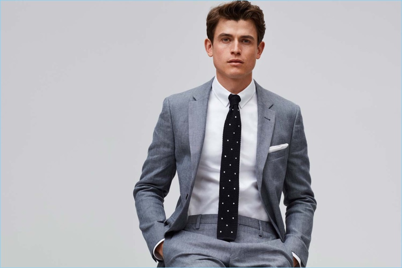 Donning a sharp grey suit, Luc van Geffen stars in GANT's spring-summer 2018 campaign.