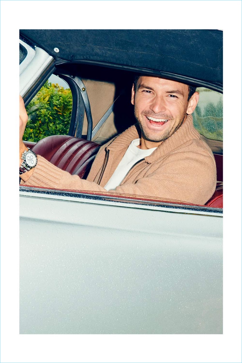 Getting behind the wheel, Grigor Dimitrov wears a Mr P. sweatshirt and Brioni zip-through sweater.