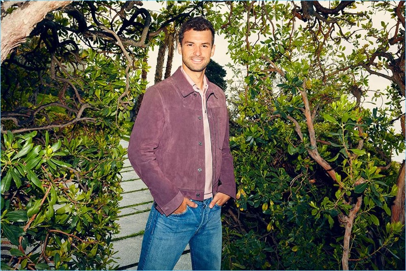 Starring in a style shoot, Grigor Dimitrov wears a Dunhill polo shirt and Brunello Cucinelli jeans.