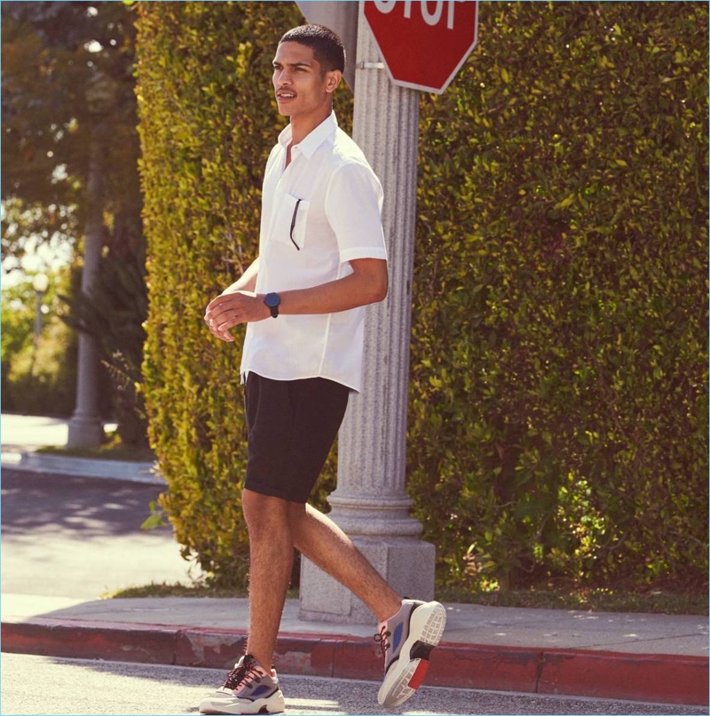 Embracing black and white, Geron McKinley wears a cotton shirt and linen-blend shorts from H&M.