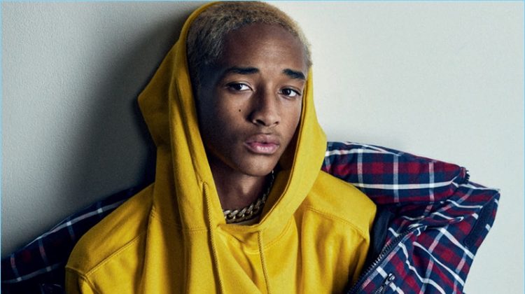 Actor Jaden Smith wears a JUUN.J coat, G-Star jeans, and a Supreme belt. He also sports a MSFTSrep sweater and shirt.