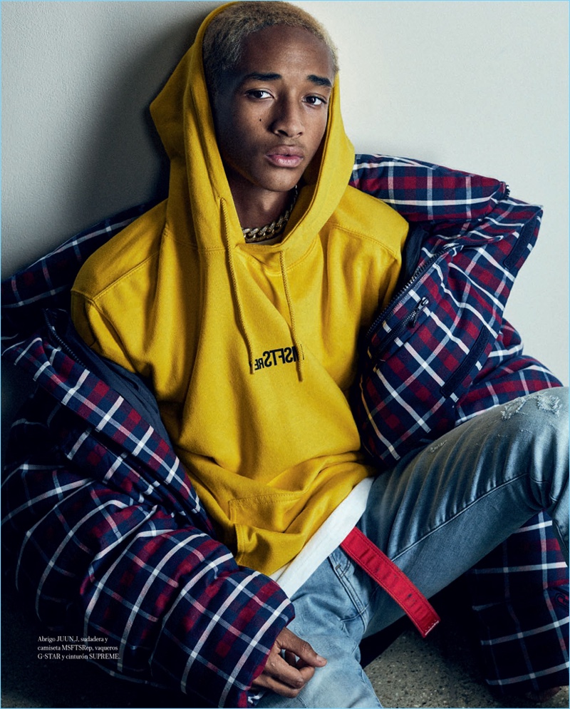 Actor Jaden Smith wears a JUUN.J coat, G-Star jeans, and a Supreme belt. He also sports a MSFTSrep sweater and shirt.