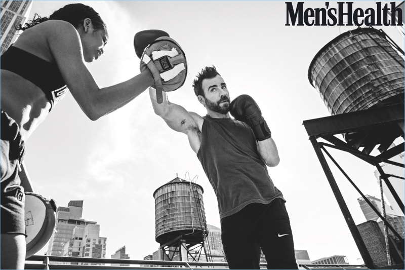 Working out, Justin Theroux wears a Kelly Cole t-shirt with Nike pants.