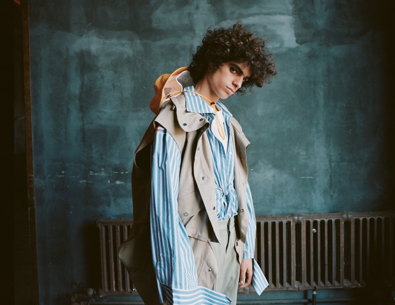 Kobe wears t-shirt JUUN.J, shirt Toit Volant, coat Feng Chan Wang, and pants Gustav von Aschenbach.