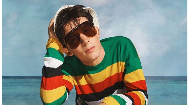 Actor Josh O’Connor wears a colorful striped sweater for Loewe's spring-summer 2019 campaign.