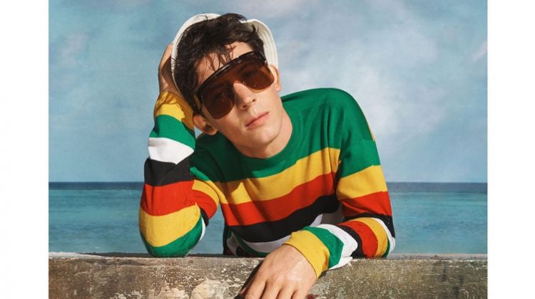 Actor Josh O’Connor wears a colorful striped sweater for Loewe's spring-summer 2019 campaign.