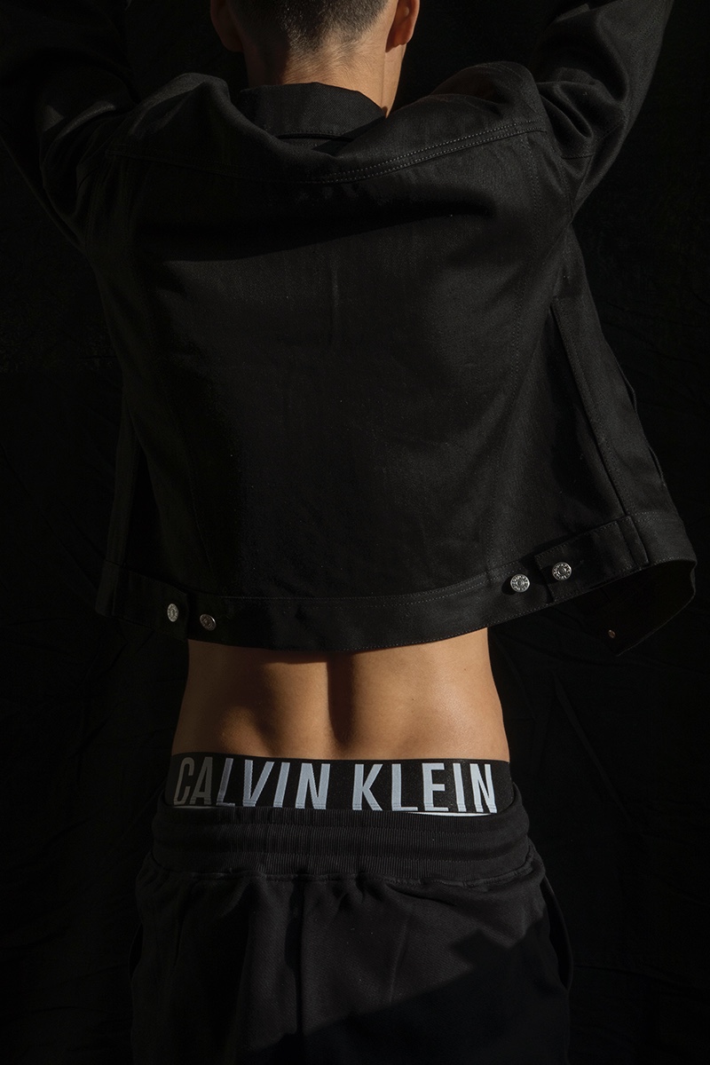 Mihn wears denim jacket Acne Studios, underwear Calvin Klein, and pants 66North.