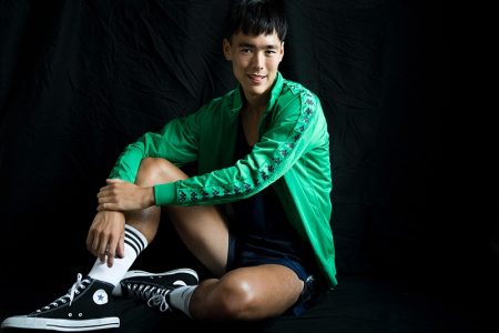Mihn wears tank Nike, jacket Kappa, shorts Han Kjøbenhavn, shoes Converse, and socks Adidas.