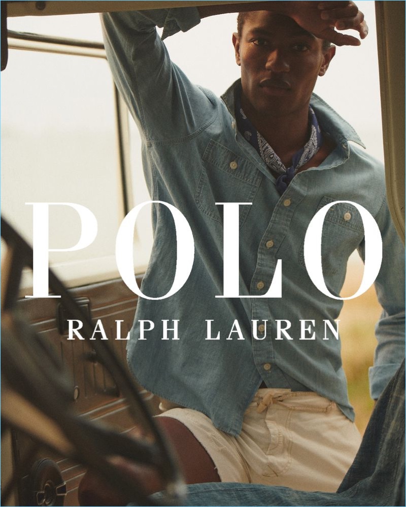 Hamid Onifade wears a denim shirt and khaki shorts fro POLO Ralph Lauren's summer 2018 campaign.
