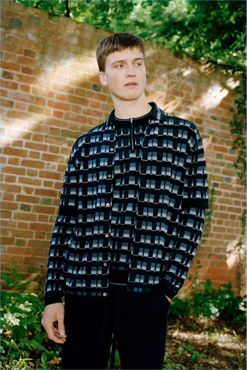 Hamish Frew wears a knit jacket and half-zip pullover from Pringle of Scotland's spring-summer 2019 collection.