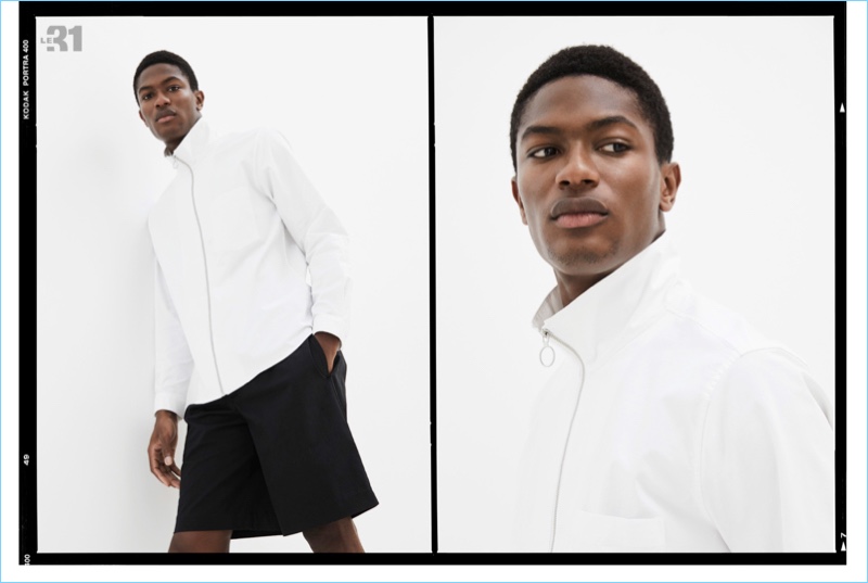 Model Hamid Onifade wears a LE 31 stand-collar Loft shirt with Bermuda shorts.