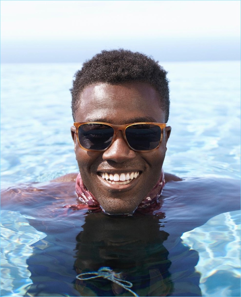 Taking a swim, Remi Alade-Chester dons Warby Parker's Fletcher Wide sunglasses.
