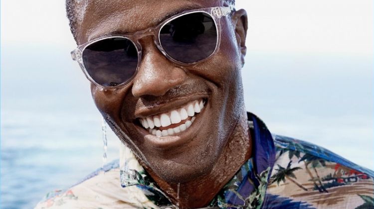 All smiles, Remi Alade-Chester wears Warby Parker's Topper Wide sunglasses.