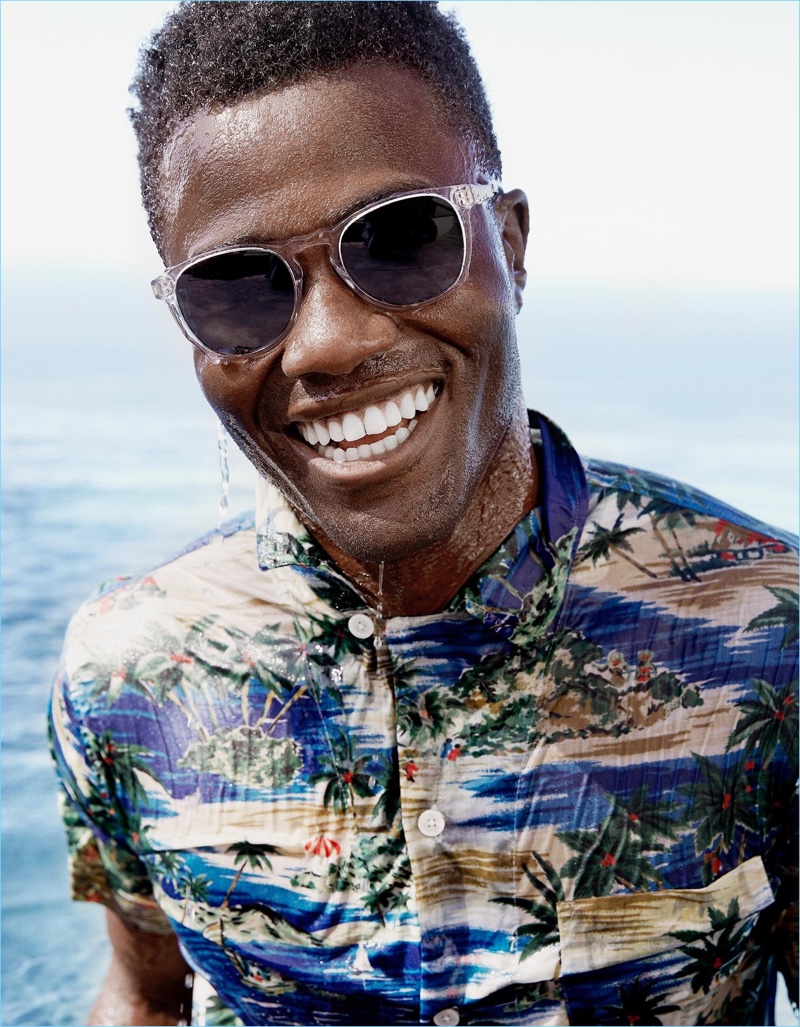 All smiles, Remi Alade-Chester wears Warby Parker's Topper Wide sunglasses.