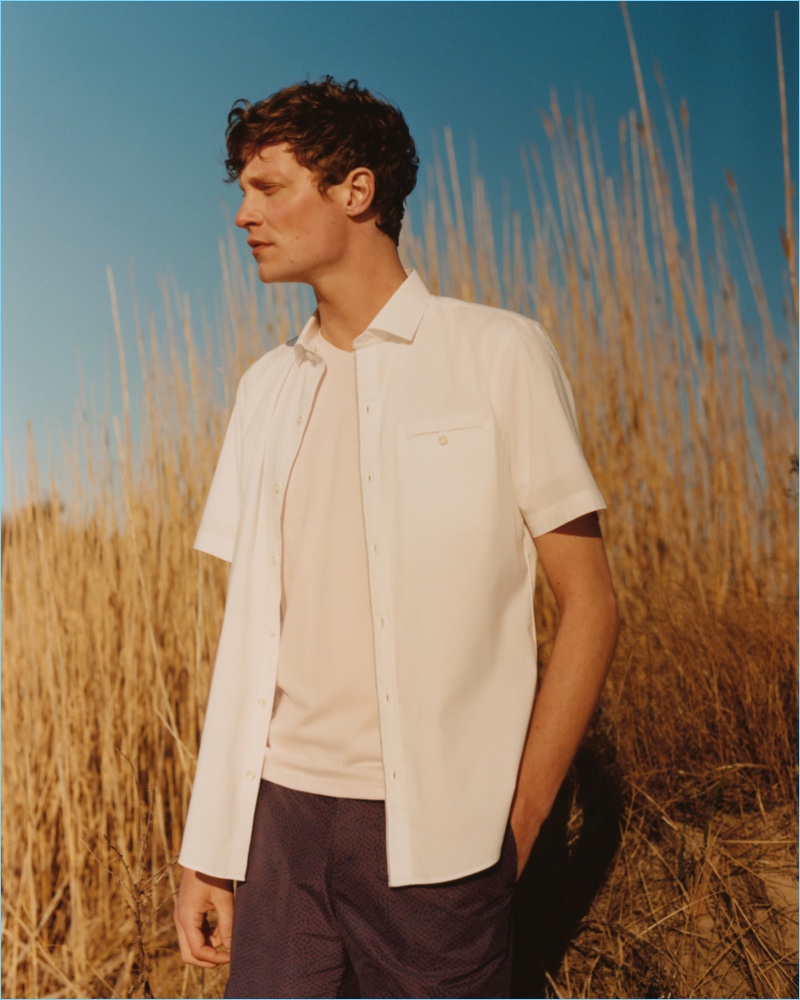Delivering a side profile, Matthew Hitt wears a casual summer look from Zachary Prell.