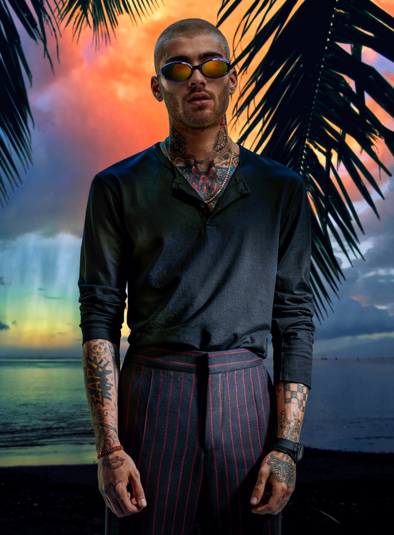 Starring in a new photo shoot, Zayn Malik wears a Dolce & Gabbana shirt, HUGO pants, Louis Vuitton sunglasses, and a Hublot watch.