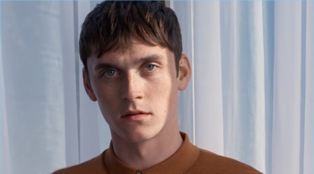 A New Palette: Anders Hayward Embraces Fall Shades for COS Anders Hayward wears a COS silk-cotton polo shirt in golden yellow.
