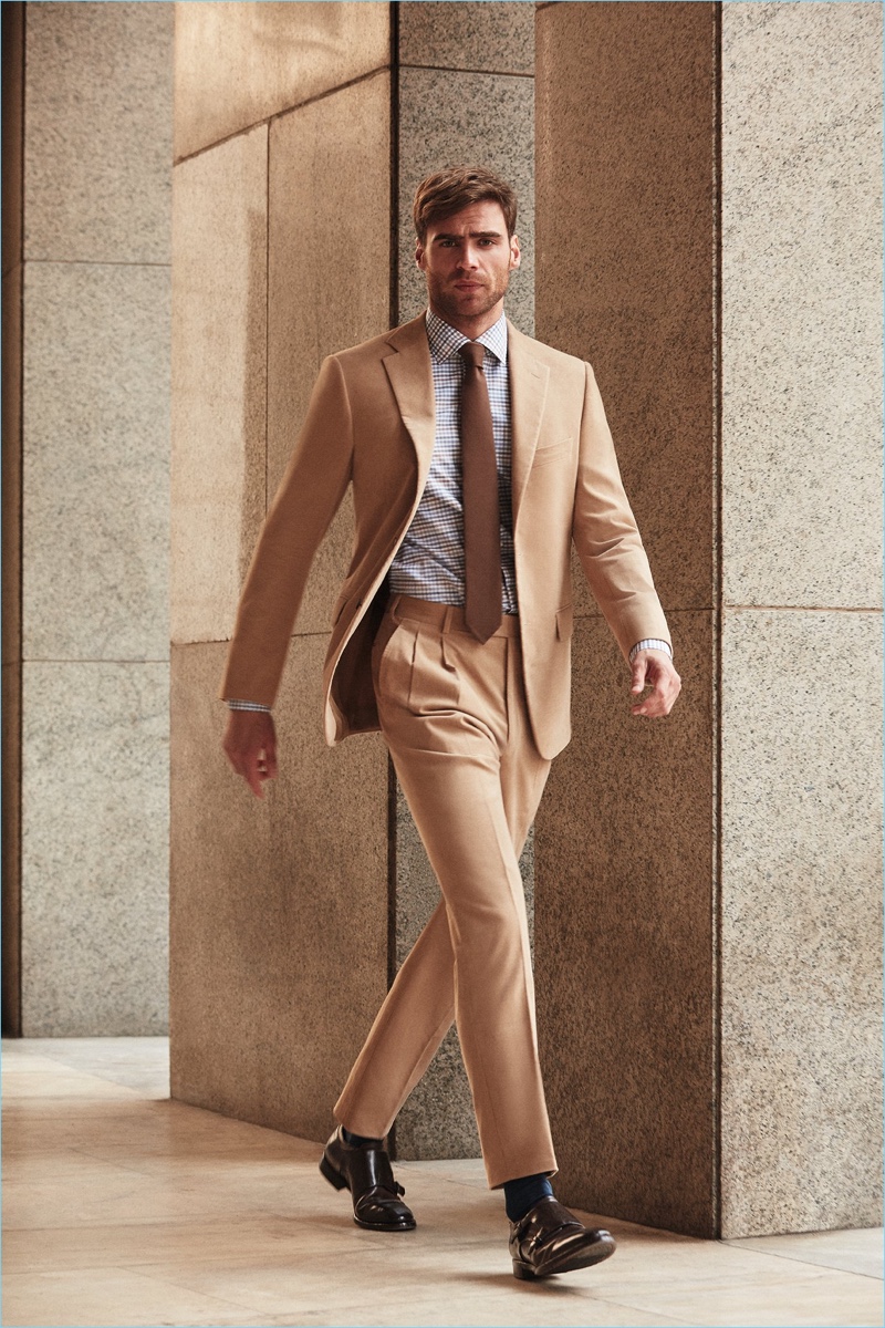 Connecting with Belvest for fall-winter 2018, George Alsford dons a camel-hued suit.