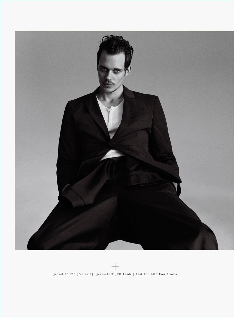 A chic vision, Bill Skarsgård dons a Prada suit jacket and jumpsuit with a Thom Browne tank. » Cruel Summer: Bill Skarsgård Dons Dark Styles for GQ A chic vision, Bill Skarsgård dons a Prada suit jacket and jumpsuit with a Thom Browne tank.