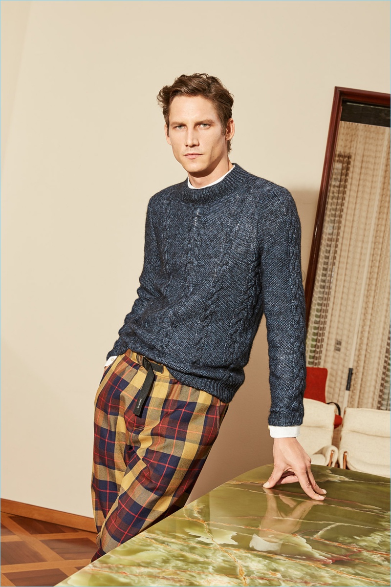 Playing it smart and casual, Roch Barbot wears a sweater and drawstring trousers by Brooksfield.