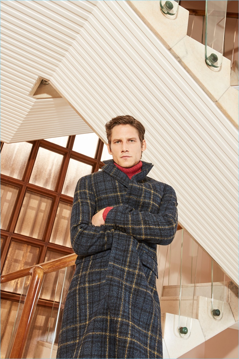Sporting a check coat and red turtleneck sweater, Roch Barbot connects with Brooksfield for fall-winter 2018.