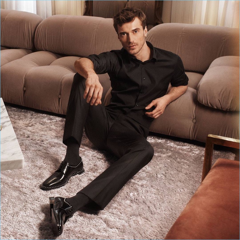 Clément Chabernaud wears Jimmy Choo's Stefan leather shoes for the brand's fall-winter 2018 campaign. The calf leather lace-up shoes feature a pearl trim.